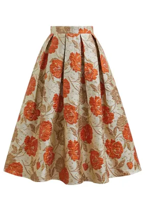 Jupe mi-longue plissée évasée en jacquard fleuri orné de motifs orange