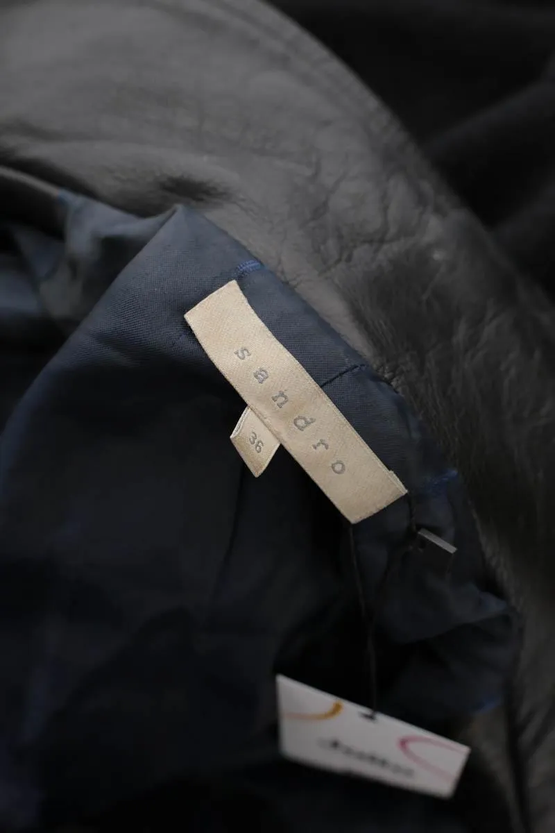 Manteau noir Sandro noir. Matière principale polyester. Taille 36.