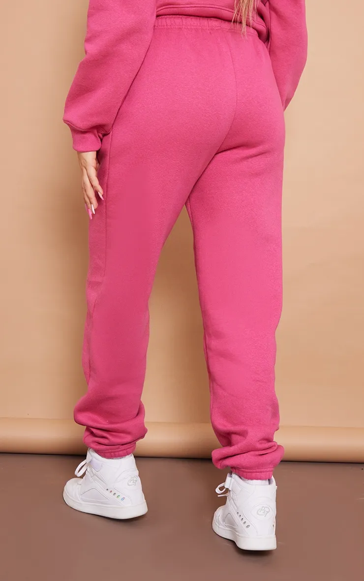 PRETTYLITTLETHING Jogging rose vif à slogan brodé